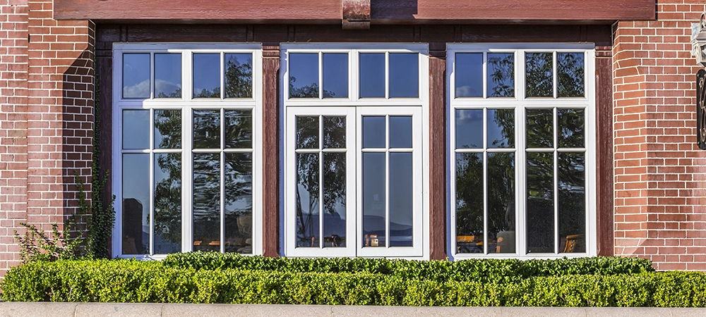 large casement windows in home backyard