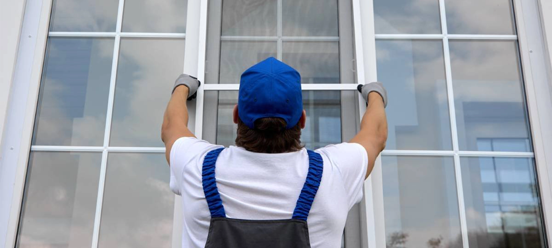 professional worker replacing the home window