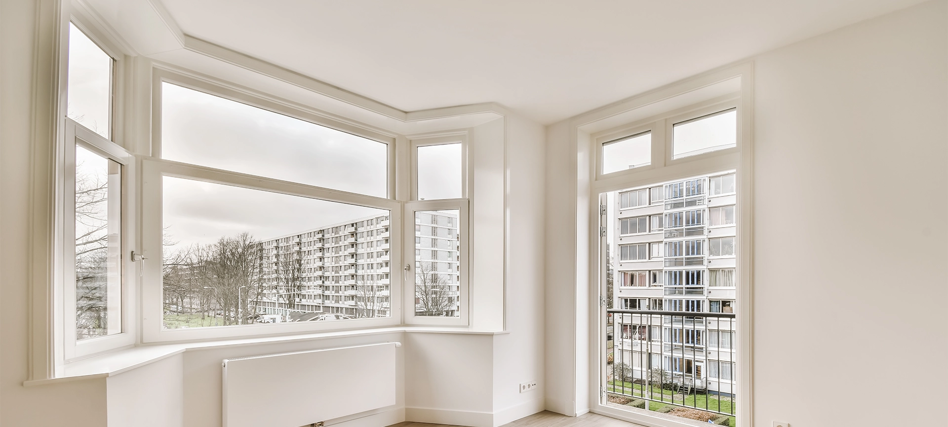 The interior of a beautiful room with white walls and a window