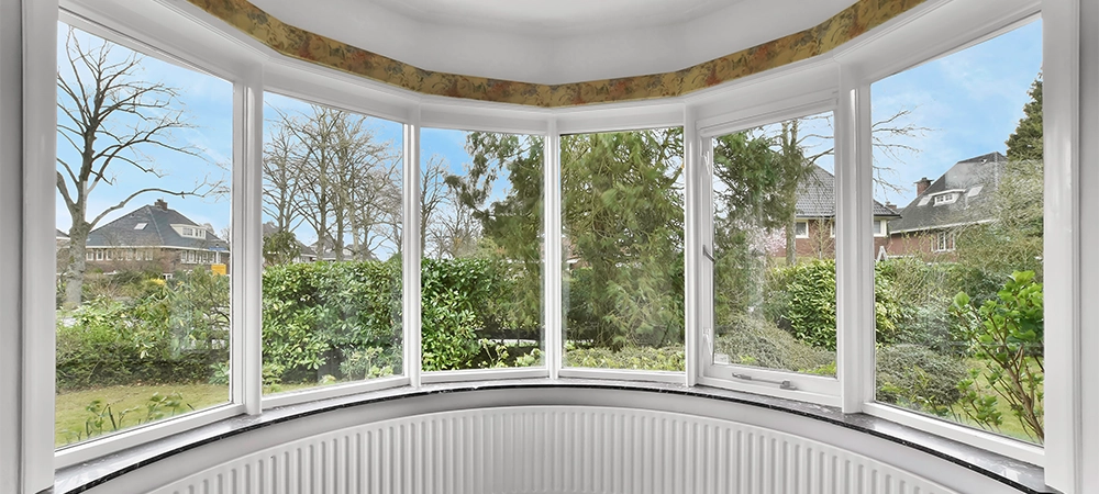 A cozy and spacious room in a luxury house and bow window close view
