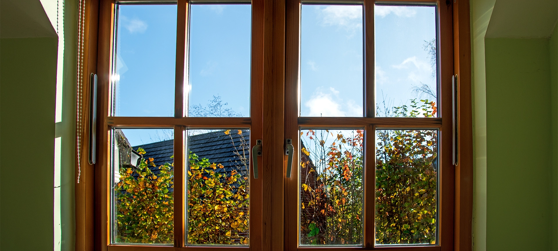 View through a Double glazed wooden window frame in the home in autumn season weather